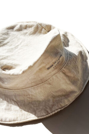 Light Brown Corduroy bucket hat featuring 'House Of Legerou' painting in gray.